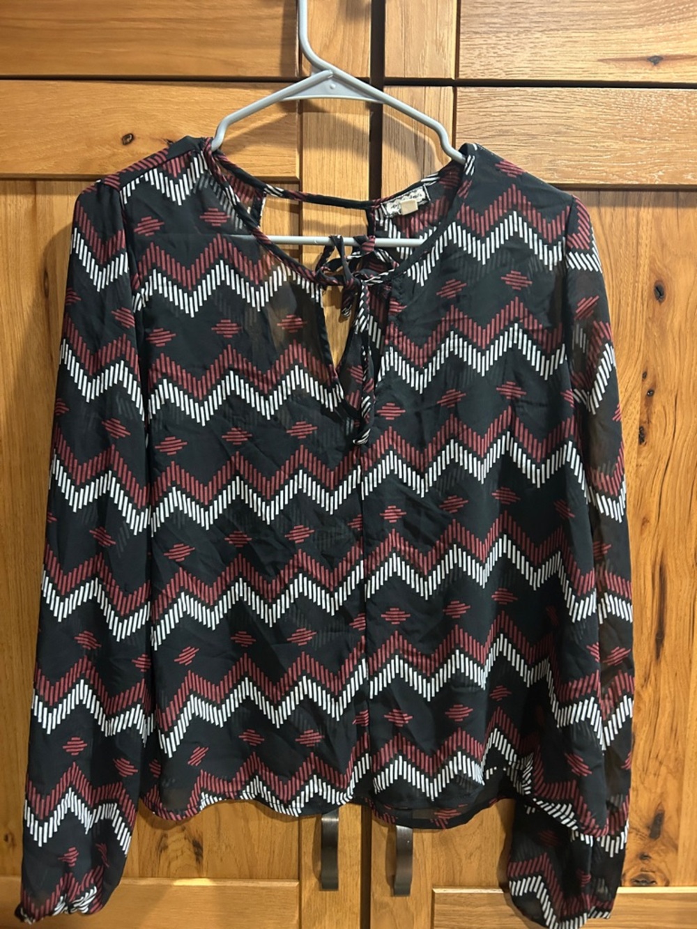 Eyeshadow Black Chevron Tie-Neck Blouse with Red and White Accents